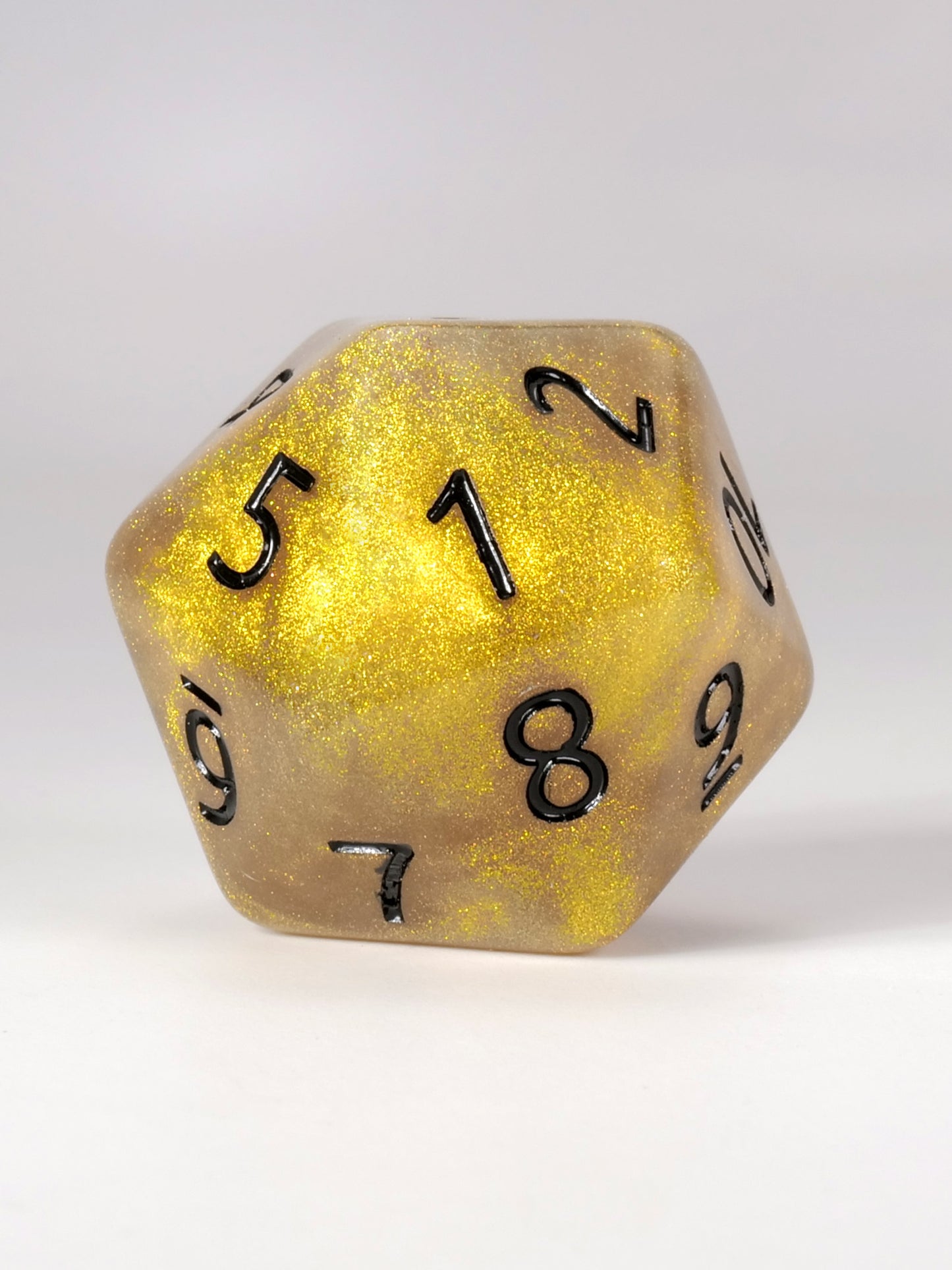 Kraken Dice Spin down Life counter Gold polyhedral dice with black numbers on a white background