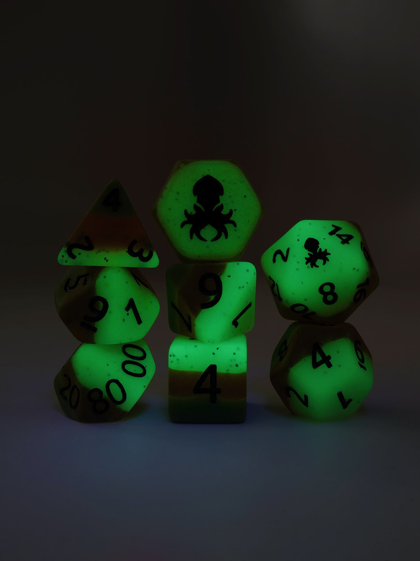 Papaya Glow in the Dark 8pc Dice Set inked in Black