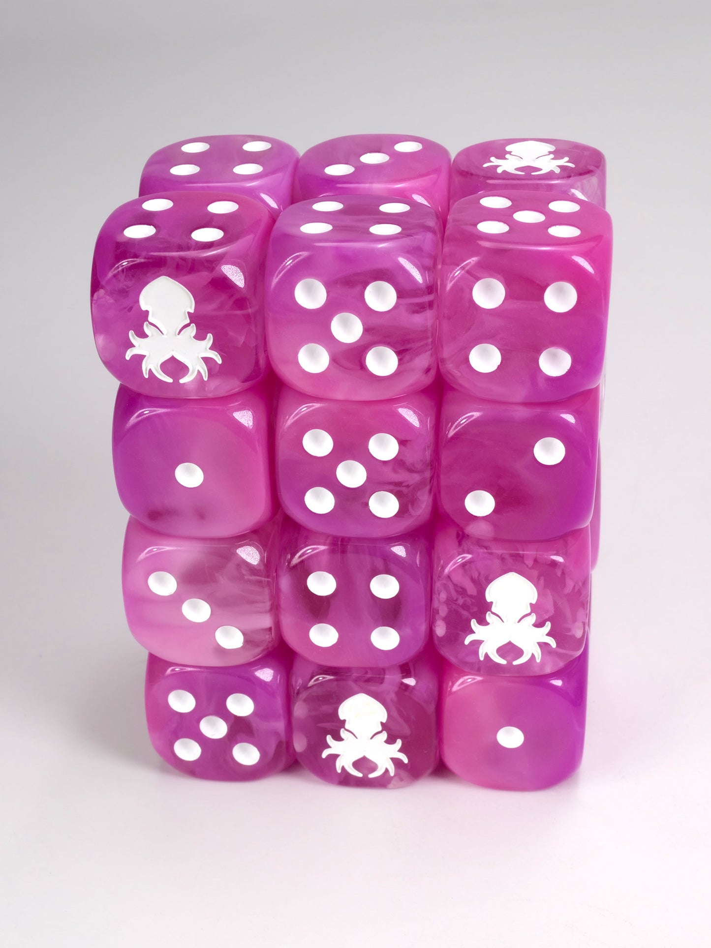 Pink dice d6 pips with rounded corners with white Kraken Dice logo Wargaming Resin Dice for War hammer type war games.