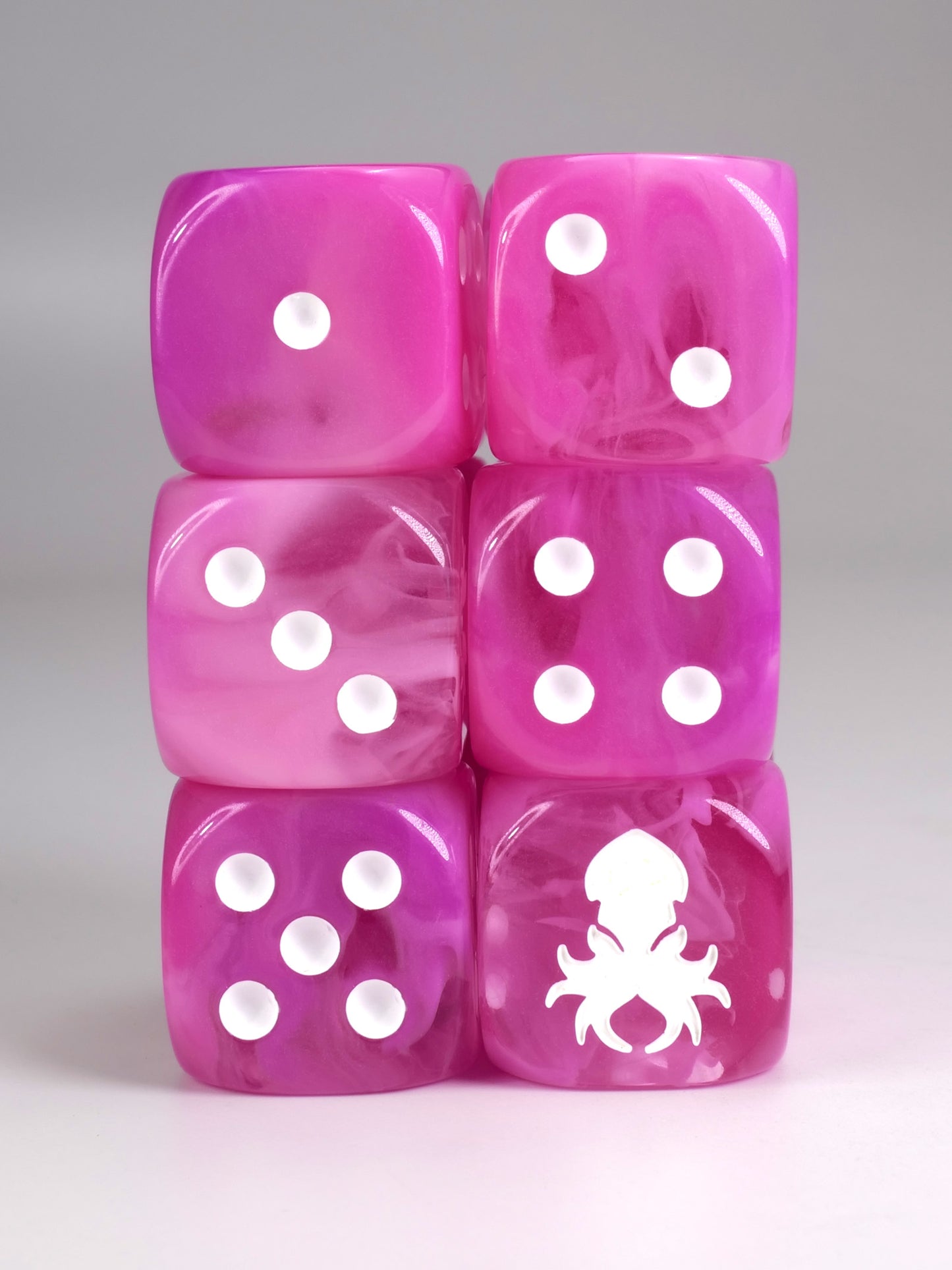 Pink dice d6 pips with rounded corners with white Kraken Dice logo Wargaming Resin Dice for War hammer type war games.