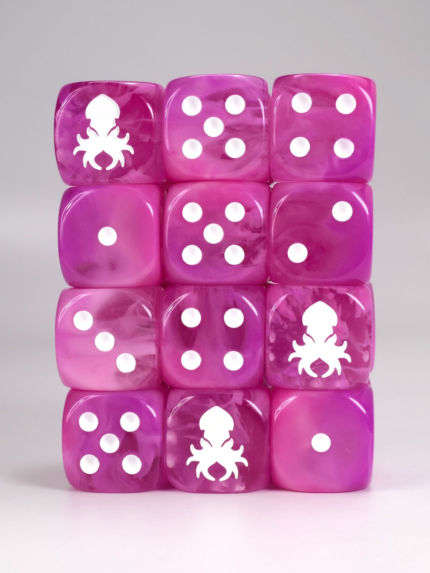 Pink dice d6 pips with rounded corners with white Kraken Dice logo Wargaming Resin Dice for War hammer type war games.
