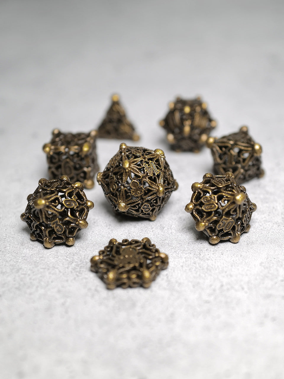 Kraken's Cabal Brass 8 piece Metal Dice Set