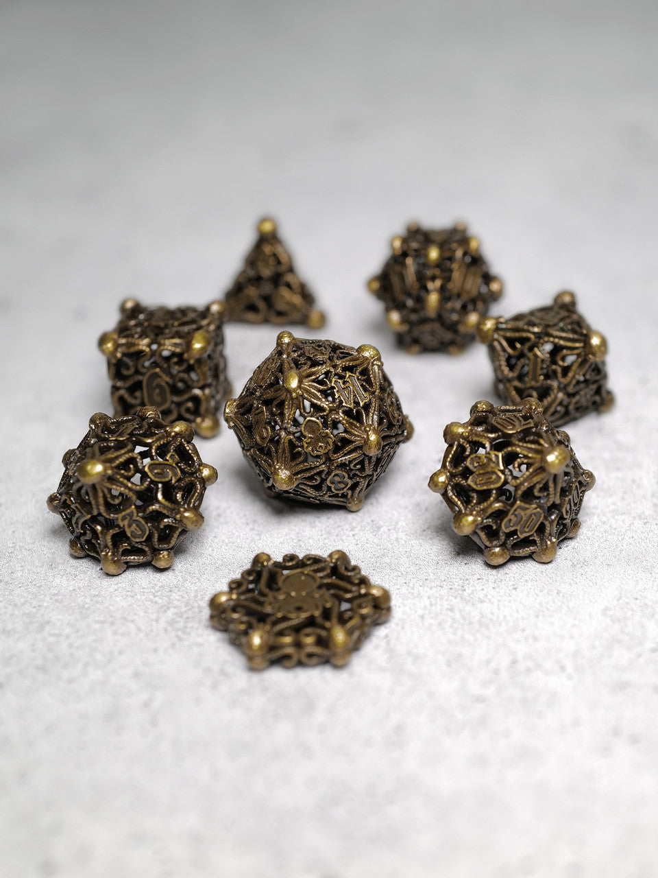 Kraken's Cabal Brass 8 piece Metal Dice Set