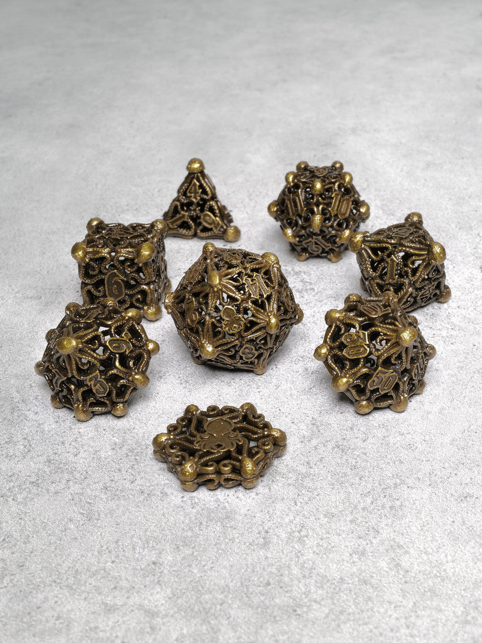 Kraken's Cabal Brass 8 piece Metal Dice Set